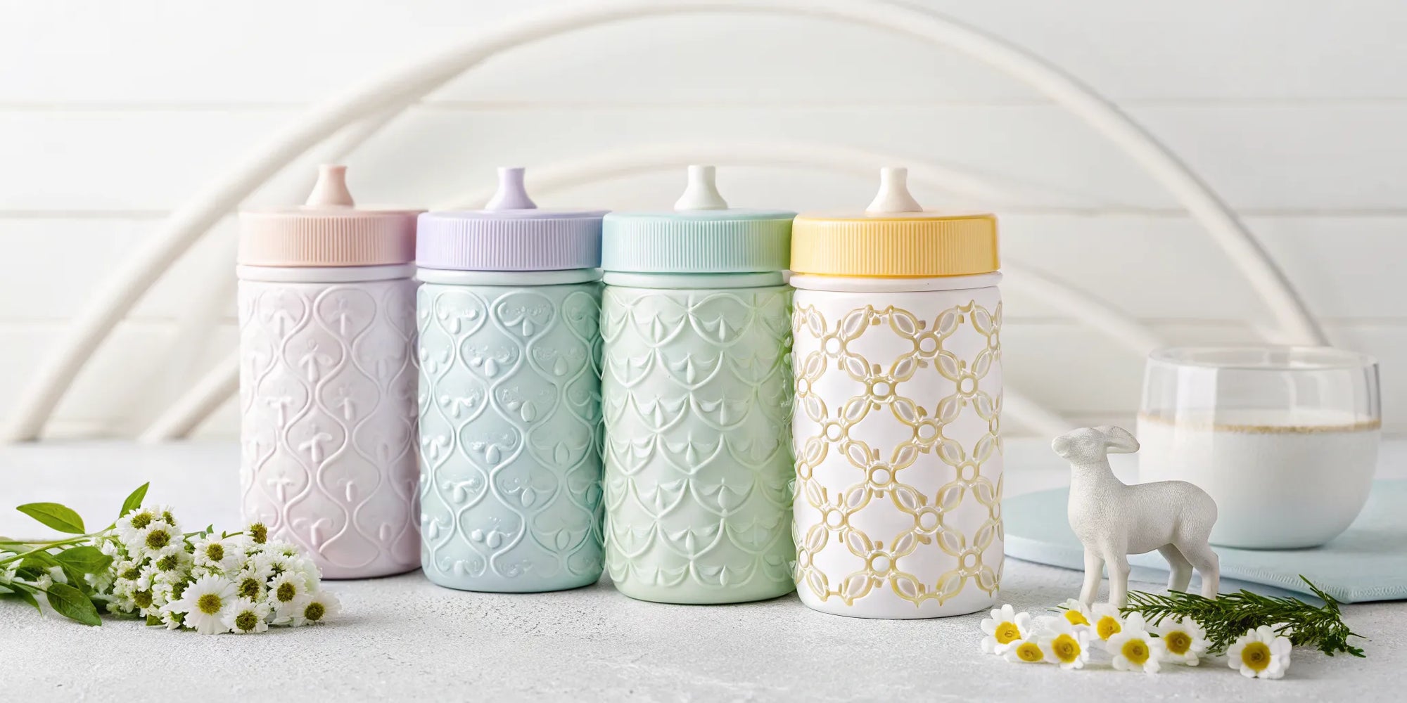 Colorful baby bottles filled with different types of easy to digest baby formula.