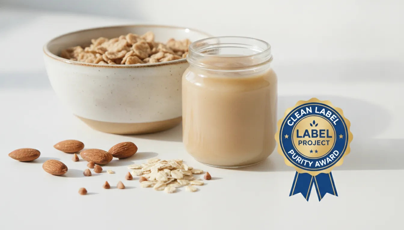 Clean Label Project Purity Award seal next to a bowl of baby cereal with whole food ingredients