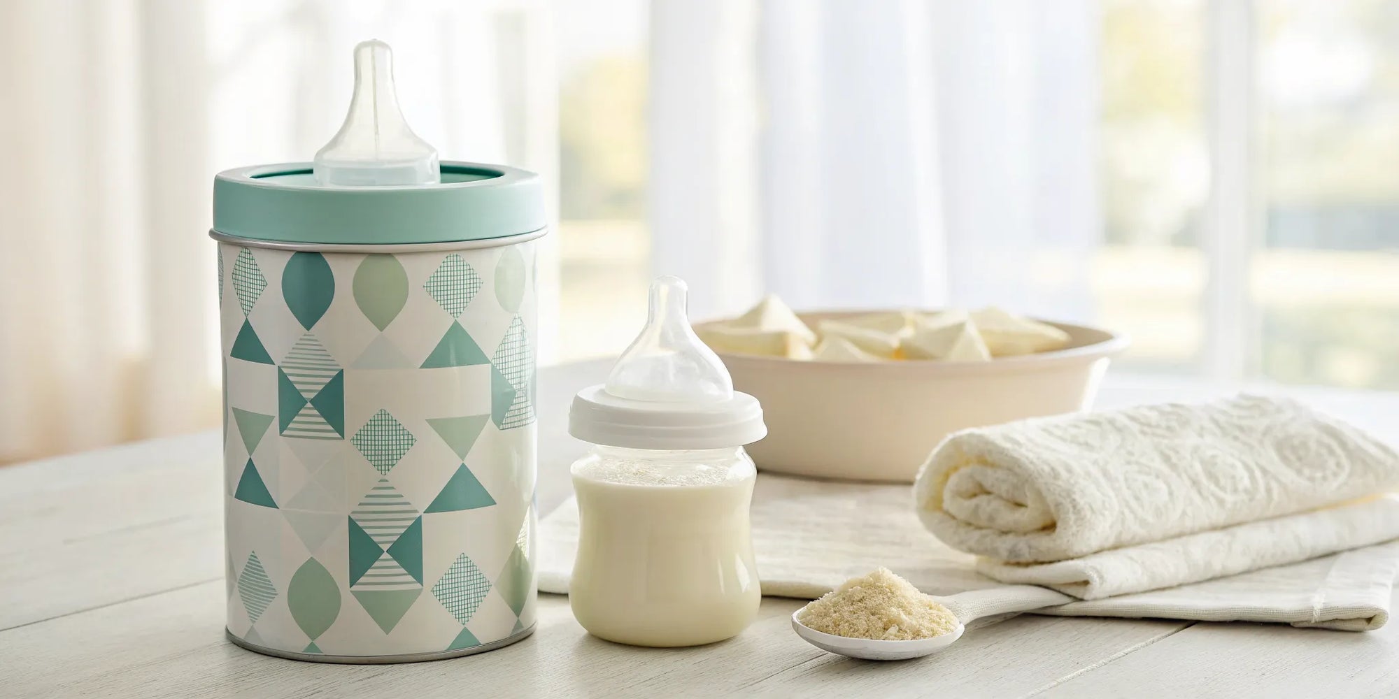 A container and bottle of hypoallergenic formula for a cow milk allergy.