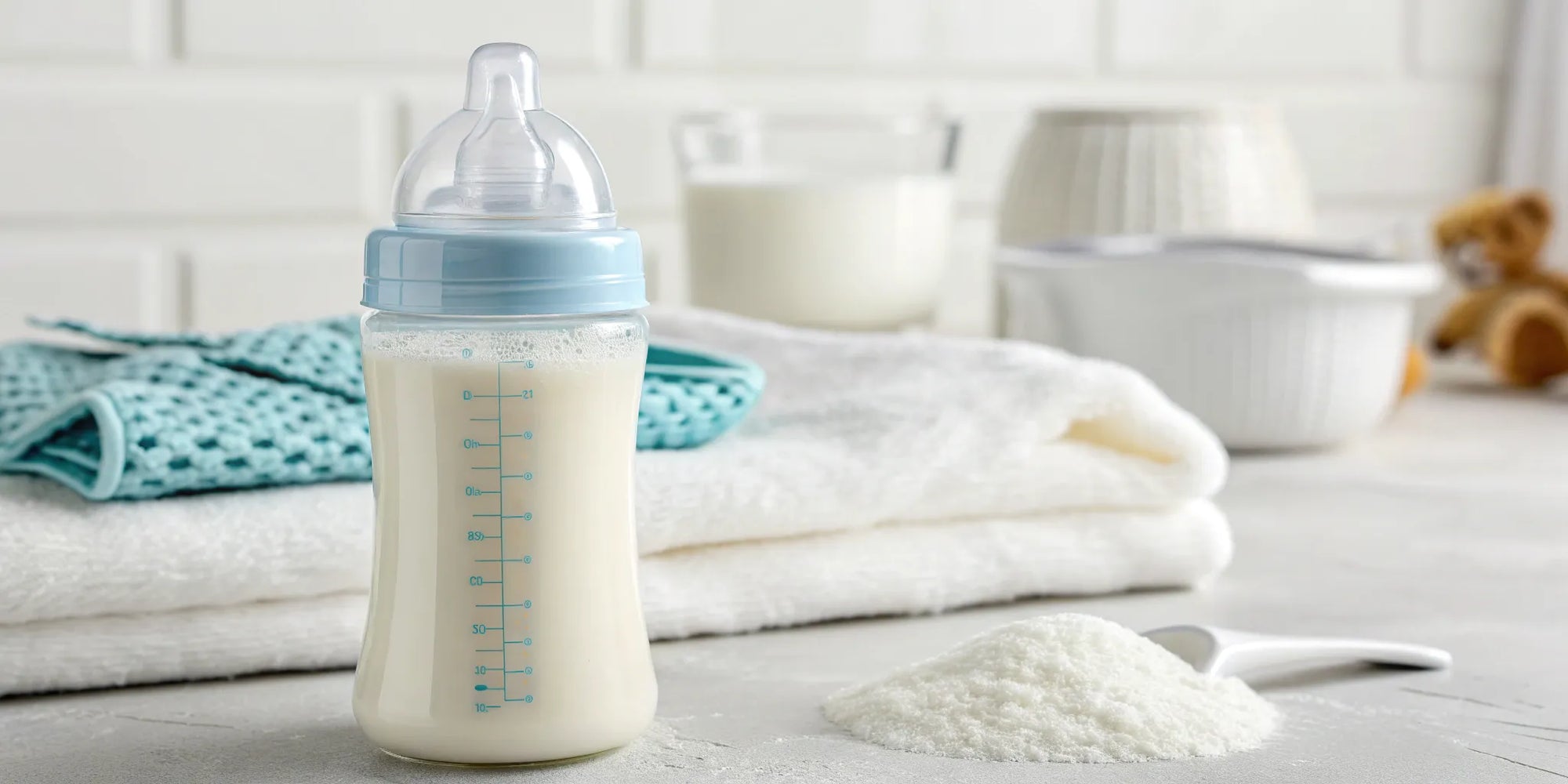 A bottle of the best hypoallergenic baby formula next to a spoonful of powder.