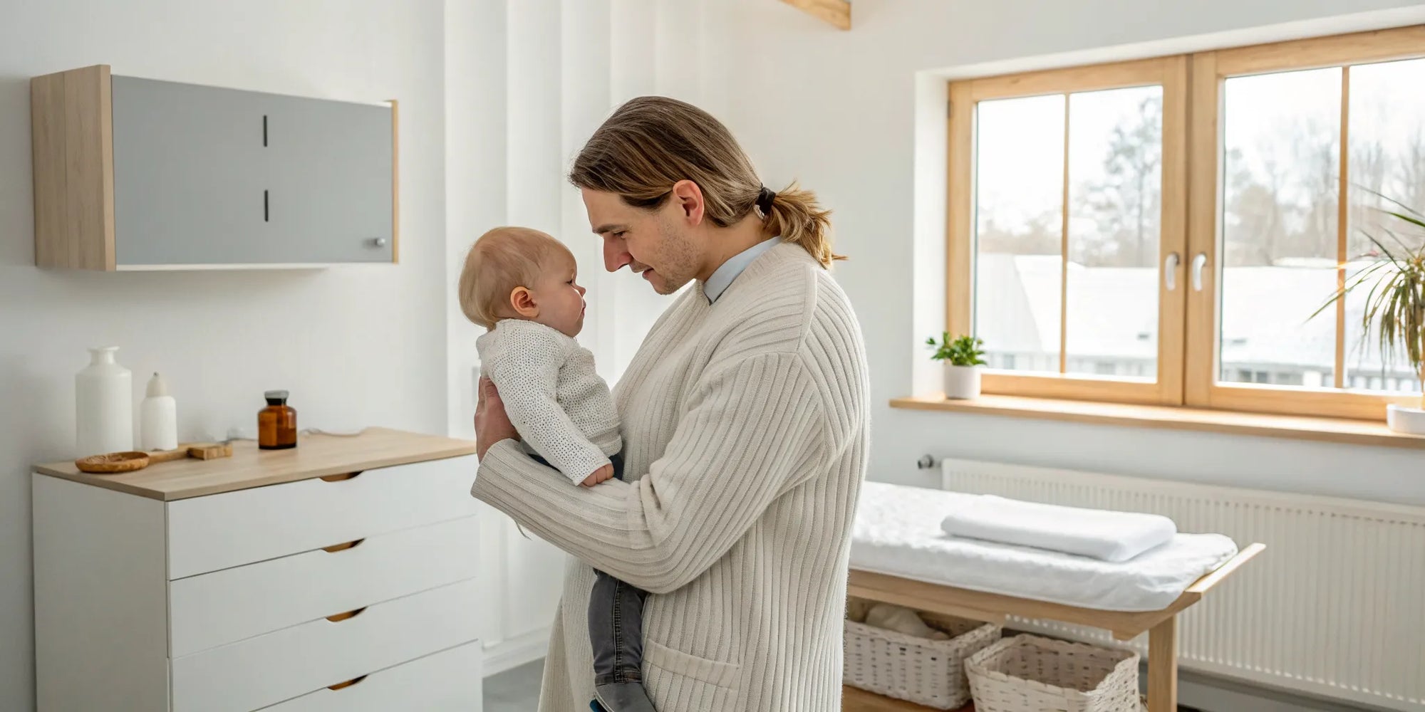 Father holding his baby, concerned about signs of lactose sensitivity.