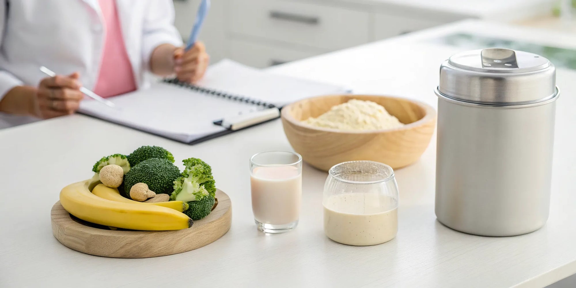 A can of baby formula for toddlers on a table with whole foods like fruits, vegetables, and milk.