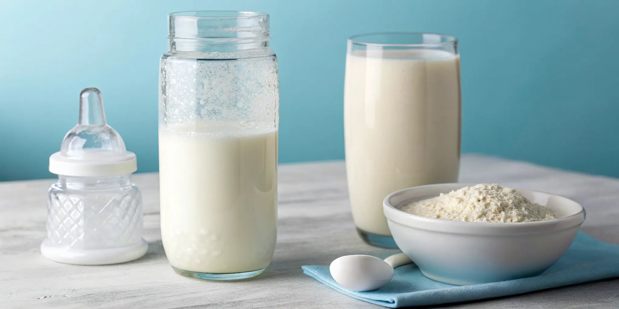 A glass of whole milk and a bowl of toddler formula for a toddler switching from a bottle.