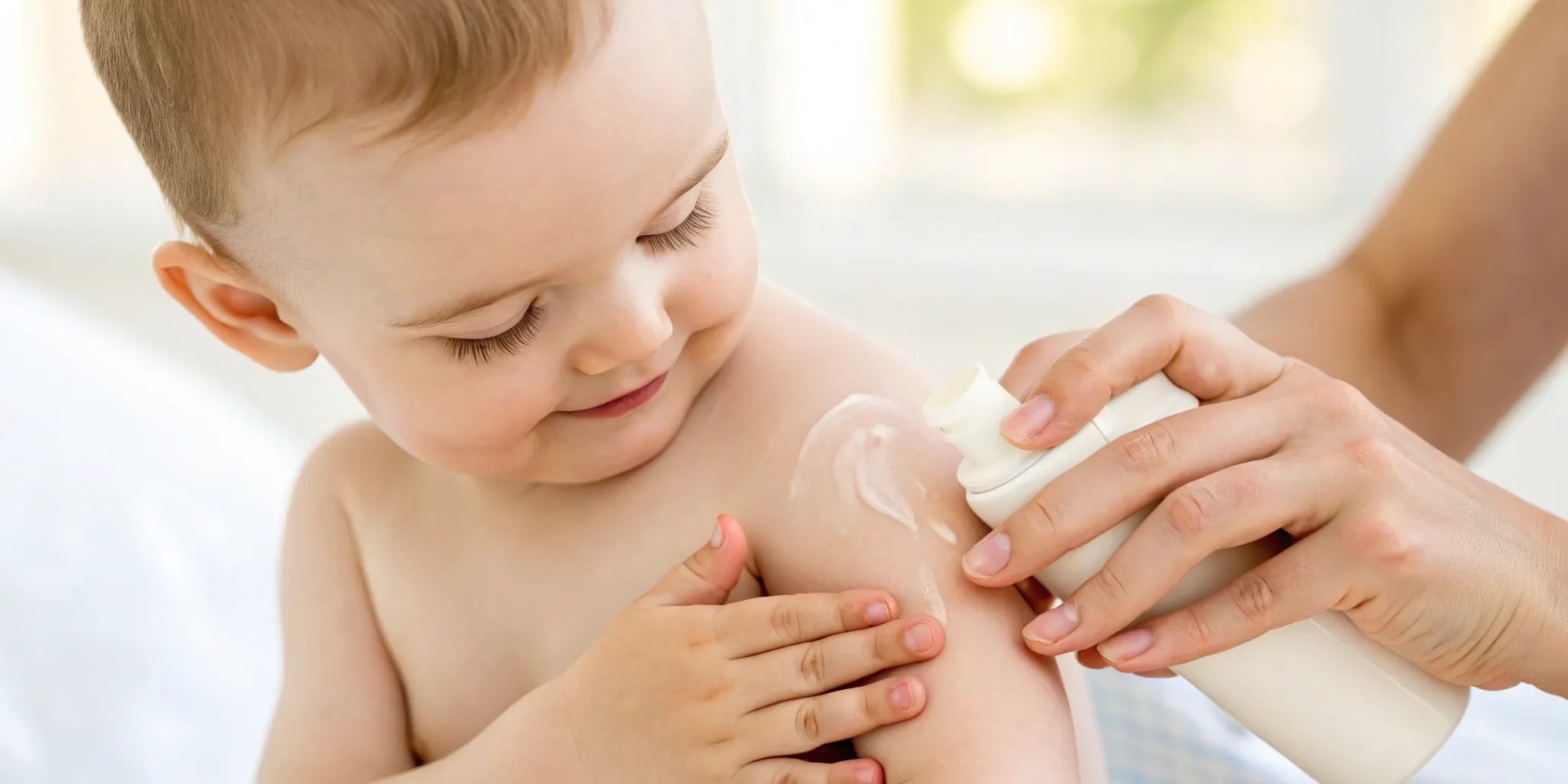 A baby receives gentle skincare for eczema, part of a complete care plan with the right formula.