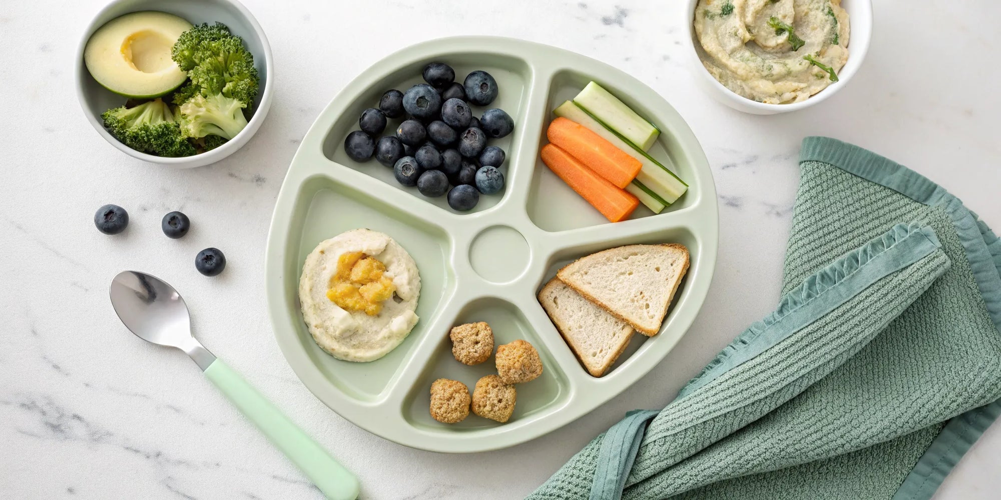 A balanced meal with avocado and berries to give a picky toddler extra nutrition.