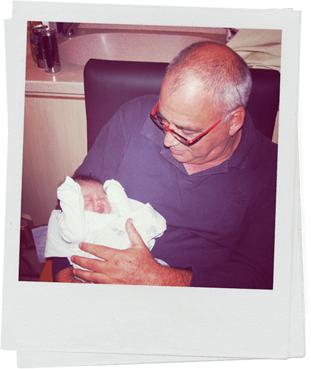 Grandpa holding baby